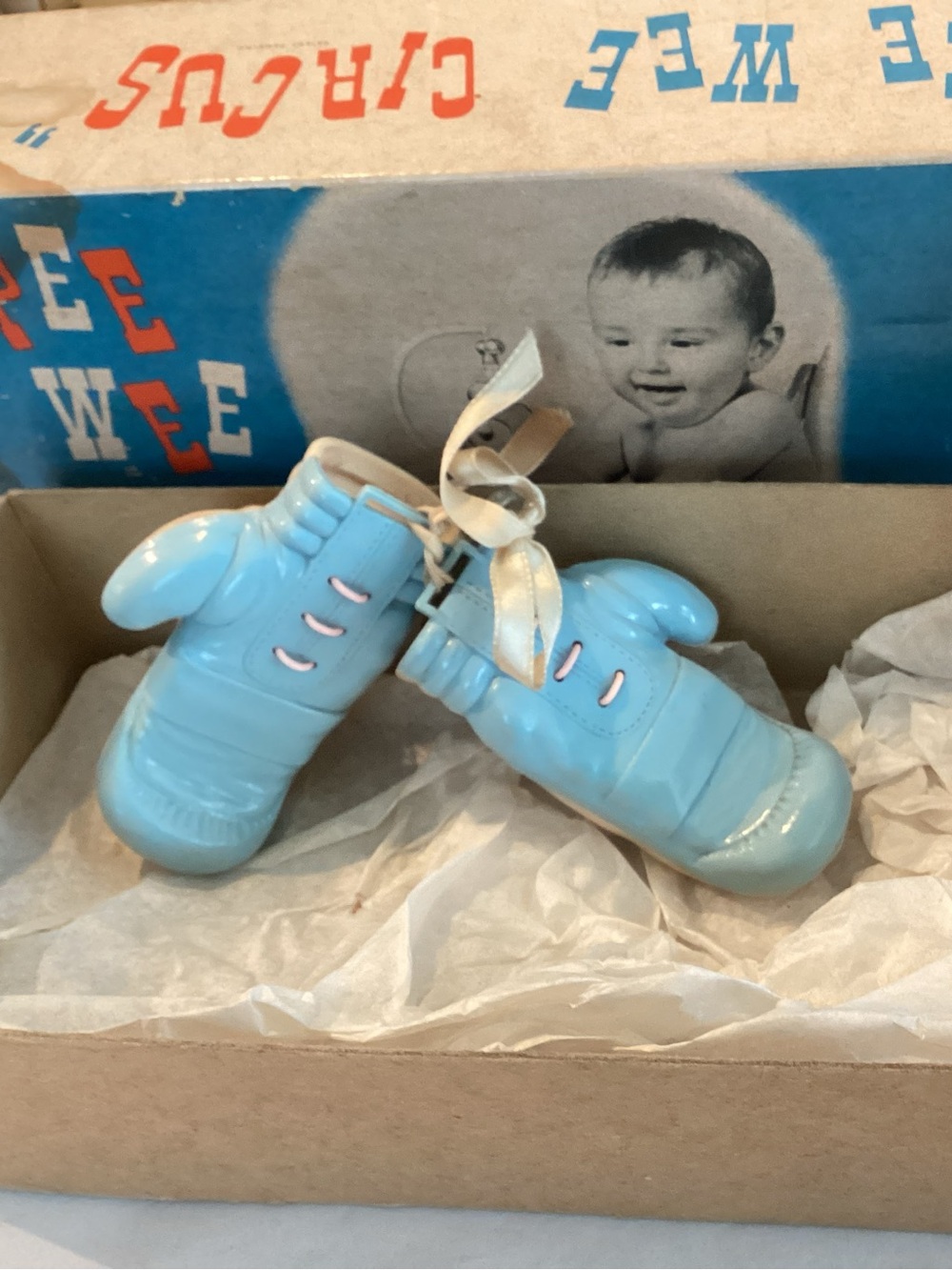 Vtg. Baby boxing gloves, light blue and pink baby rattles connected with a pink
